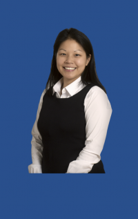 Woman wearing white buttoned shirt and black dress